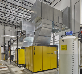 interior build out of a modern industrial facility filled with manufacturing equipment