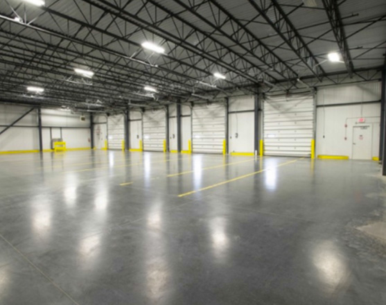 newly finished, empty interior of large warehouse distribution center