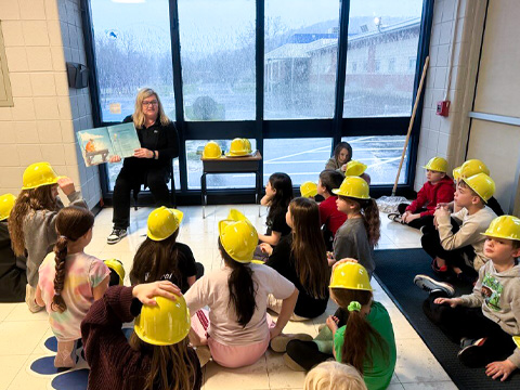 wow employee reading to children